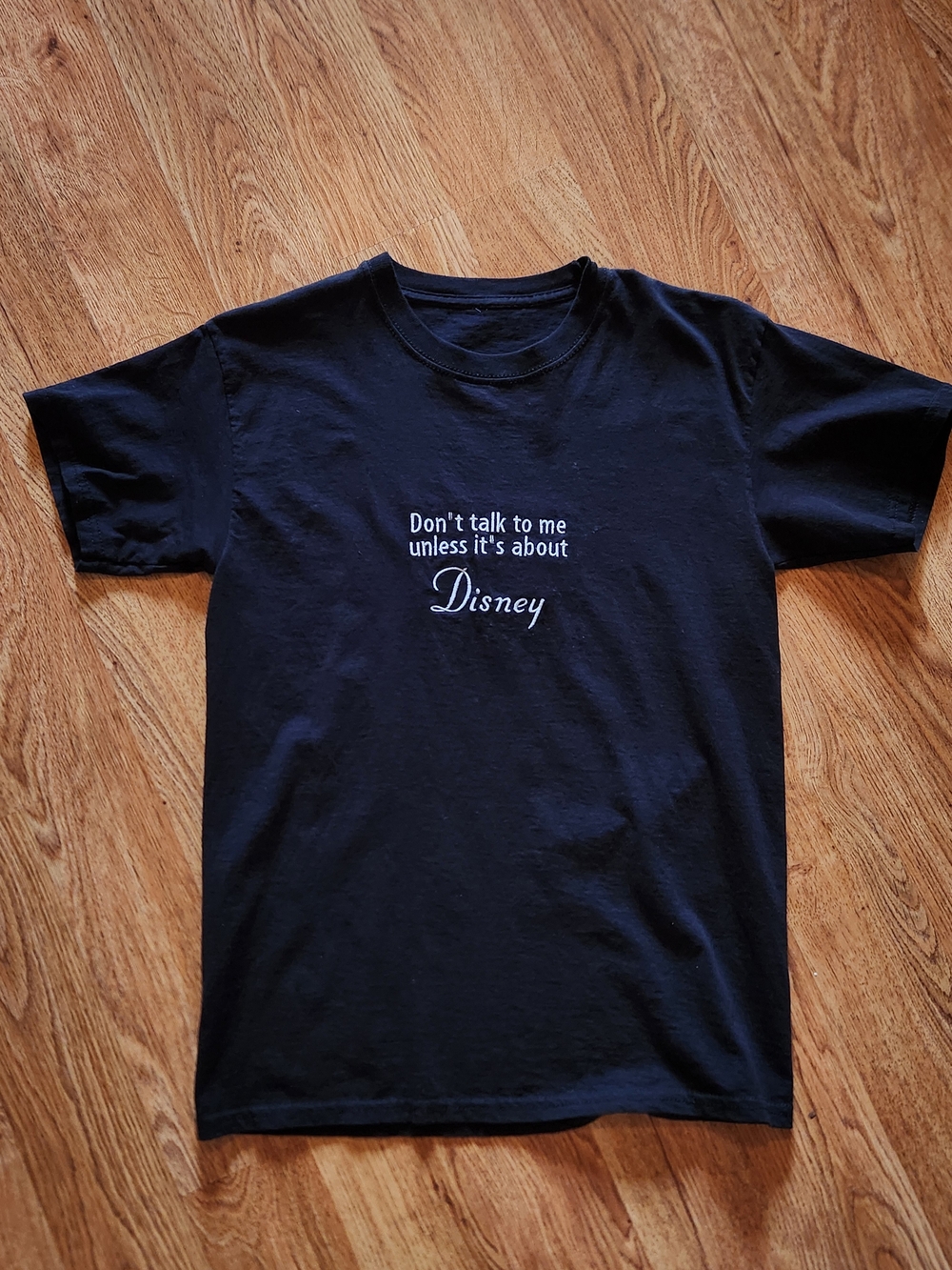 Black Tee with 'Don't talk to me unless it's about Disney' Graphic